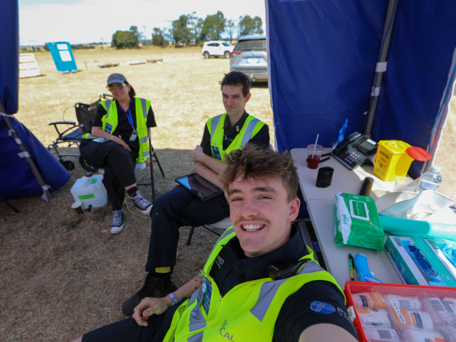 ProMED medic with an open medical kit at a festival